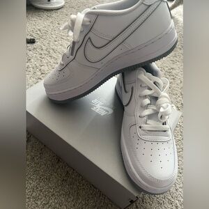 White and grey youth Air Force 1s